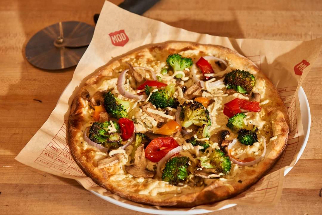 MOD vegan pizza on table