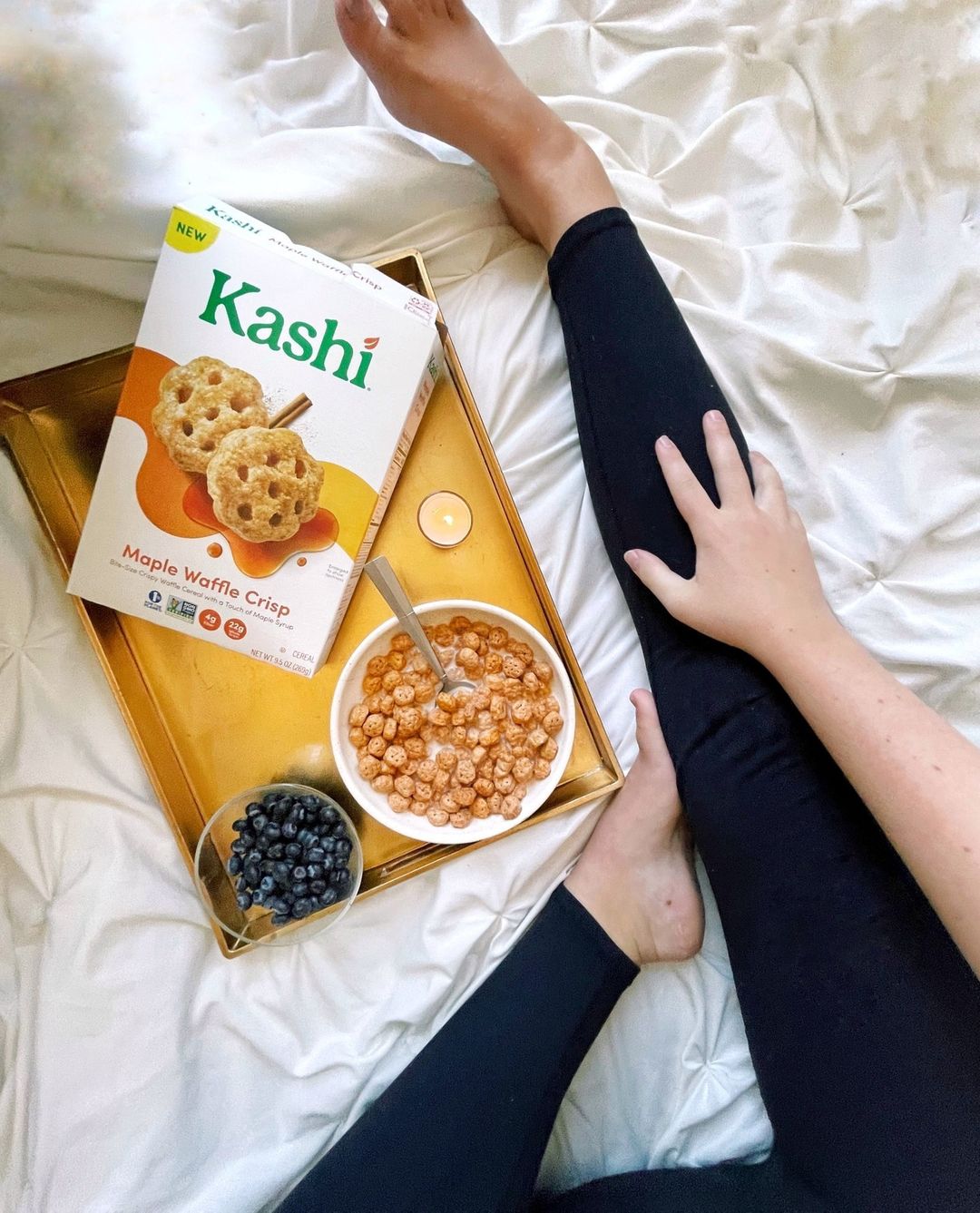 Person sitting by bowl of Kashi cereal