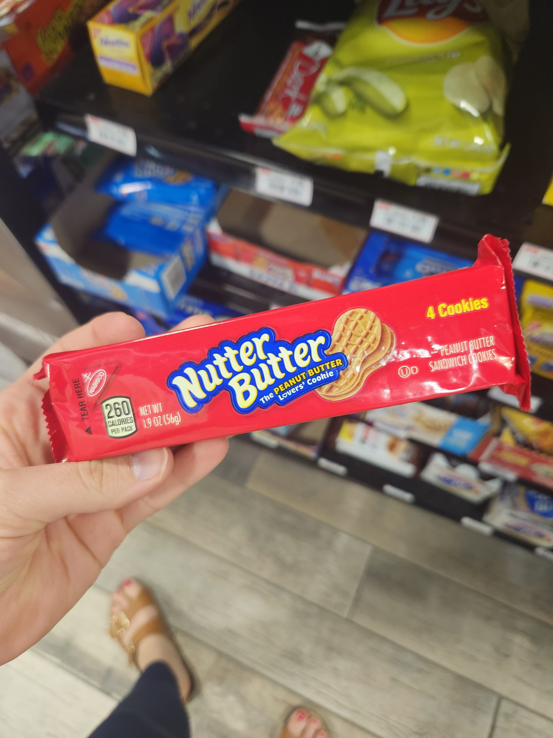 Person holding Nutter Butters inside store