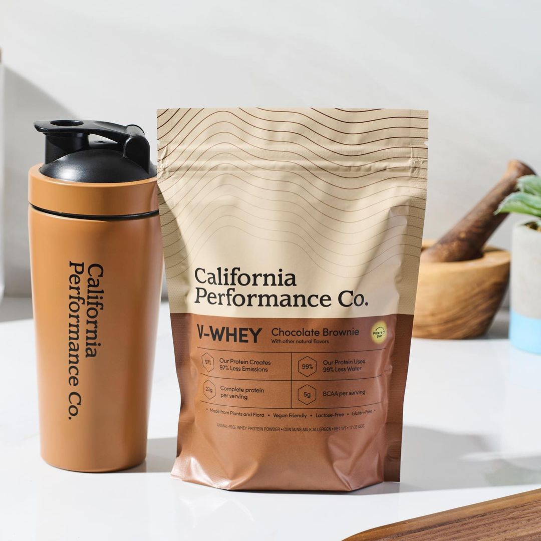 California Performance Co. protein powder with shaker bottle on counter