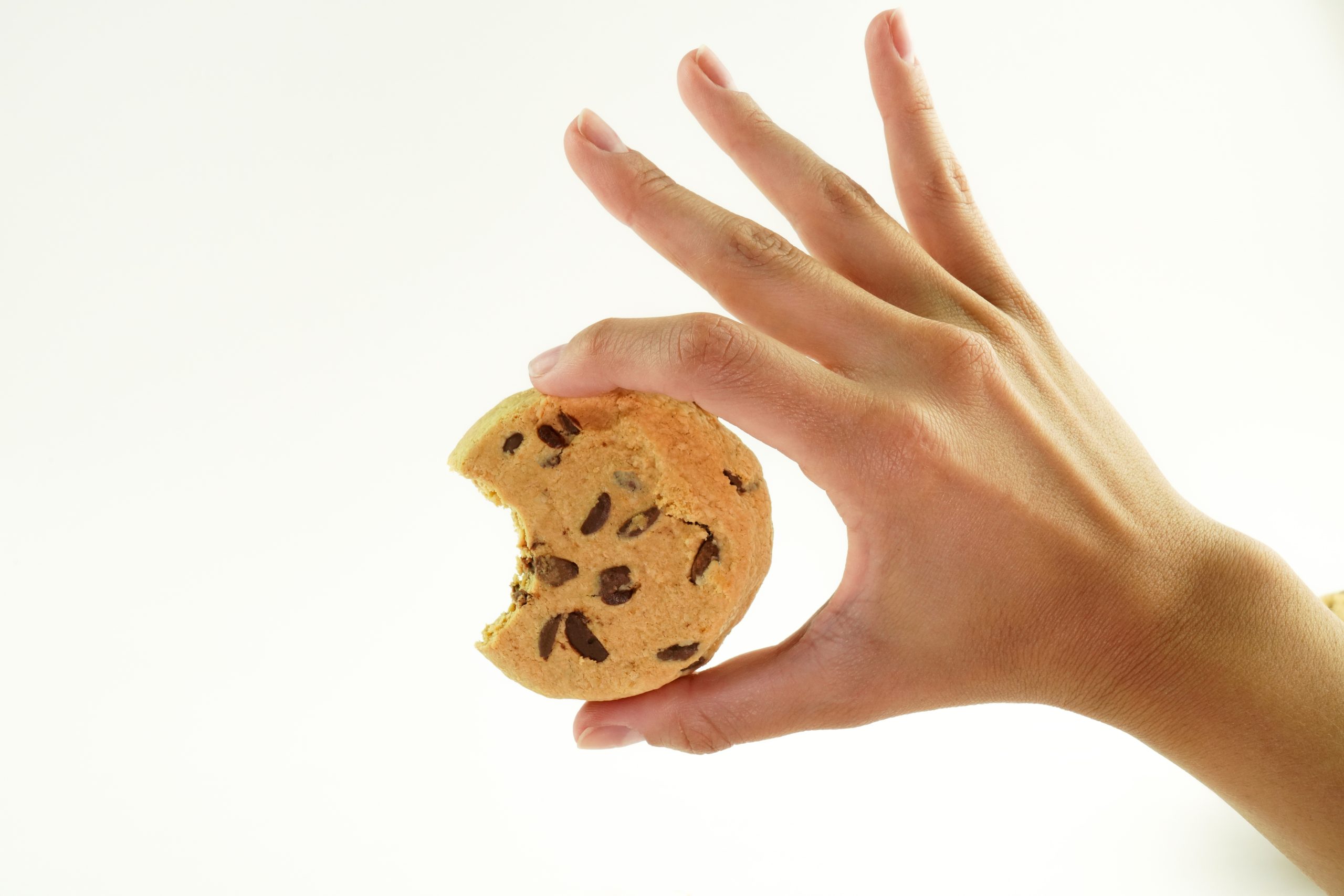 Person holding BHU Foods vegan cookie