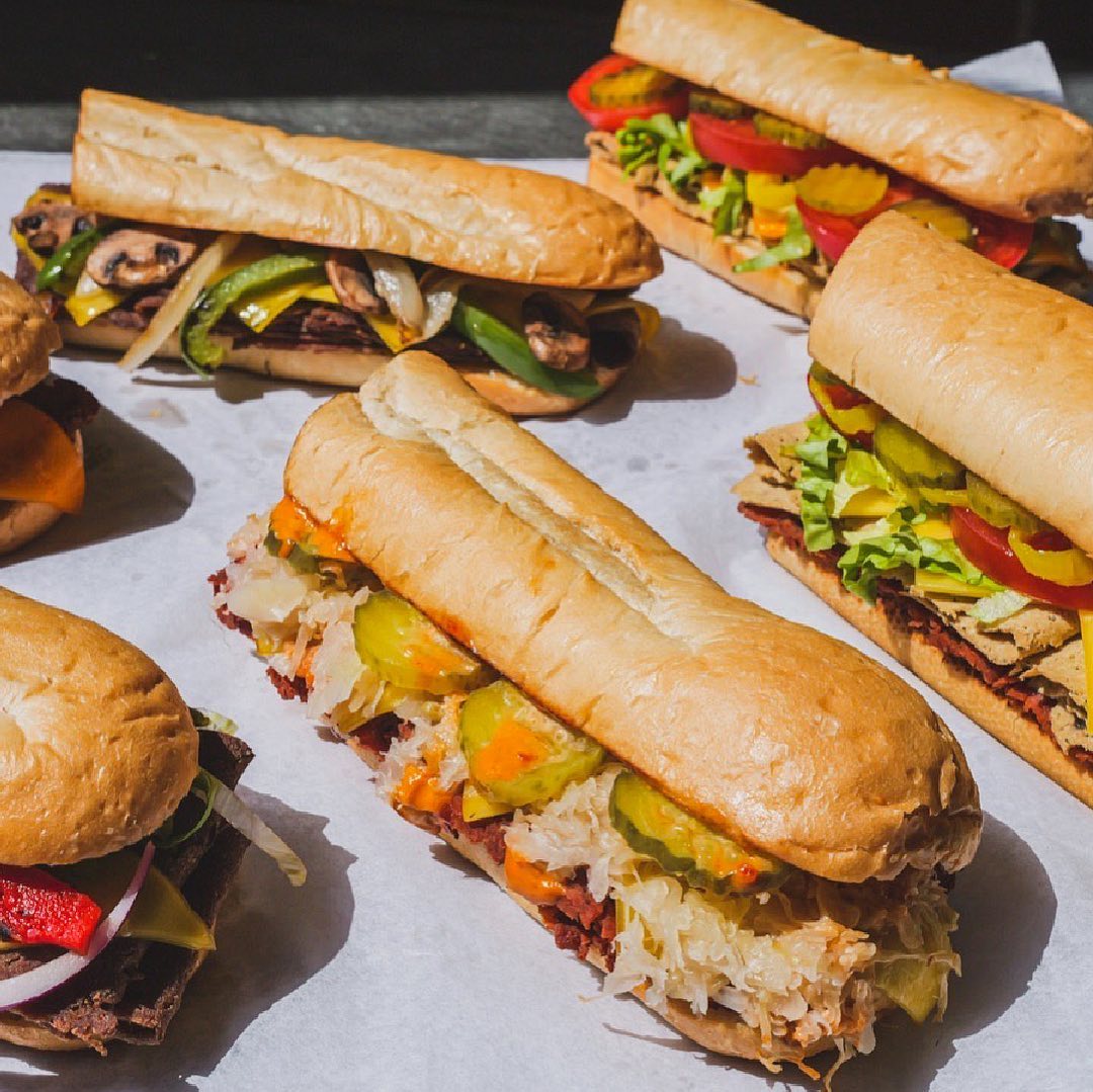 Unreal Deli sub sandwiches on table