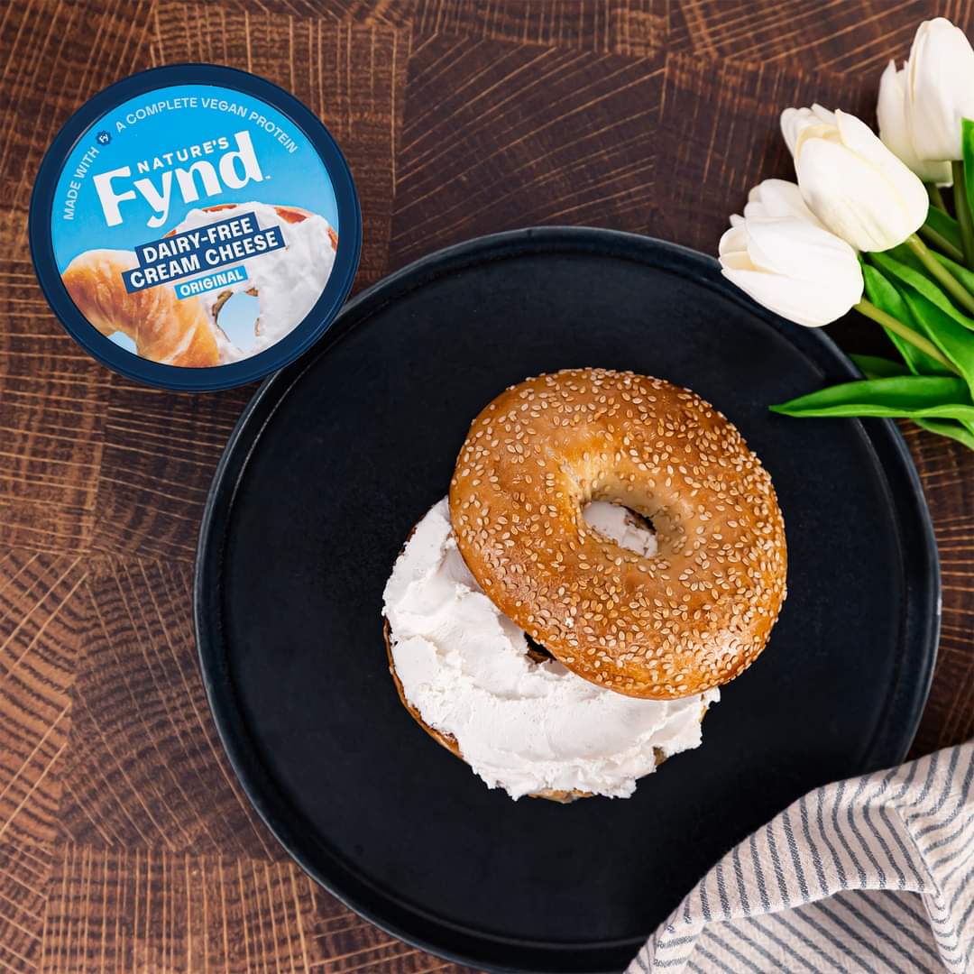 Nature’s Fynd vegan cream cheese with bagel on plate