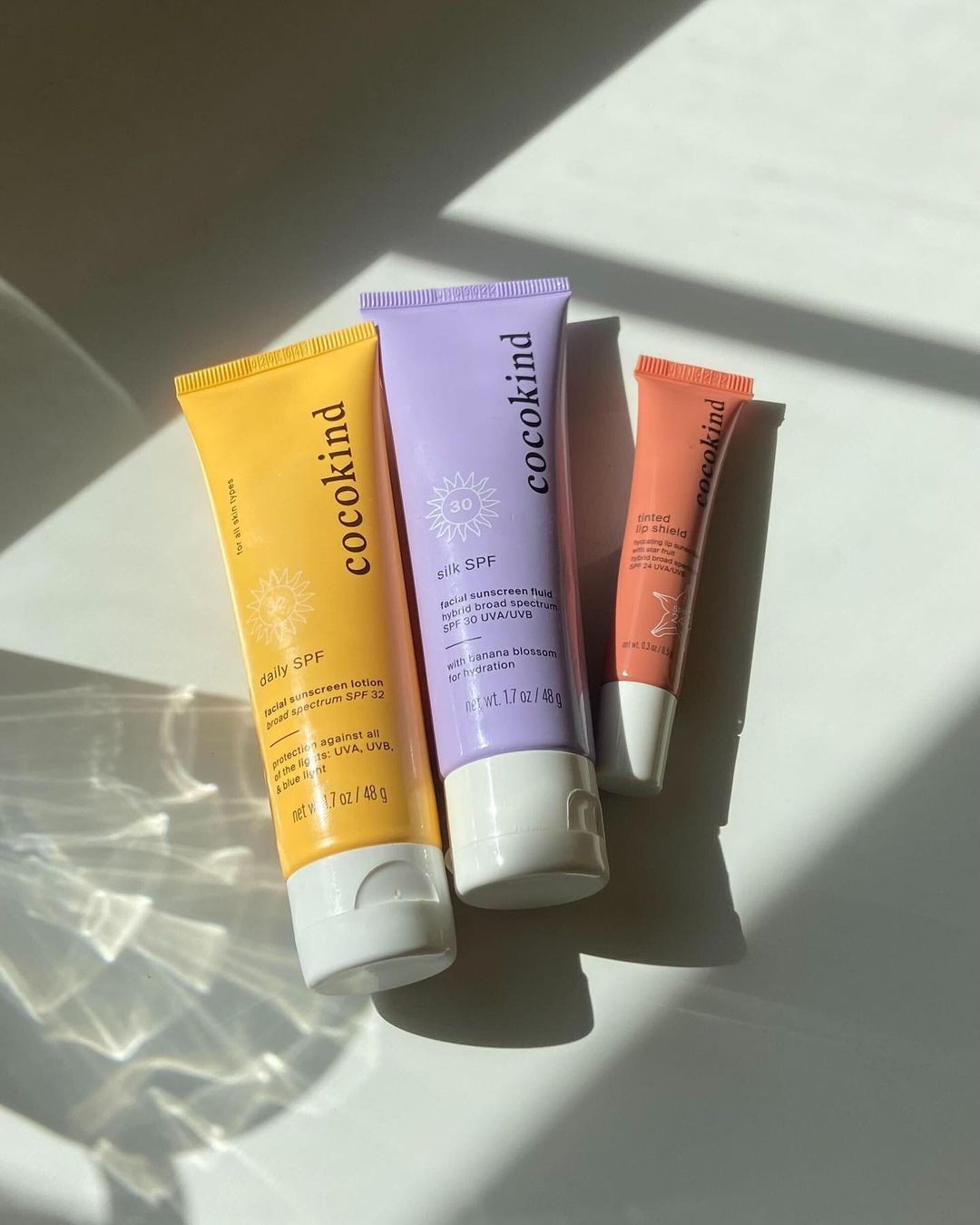 cocokind sunscreens with sun beaming in