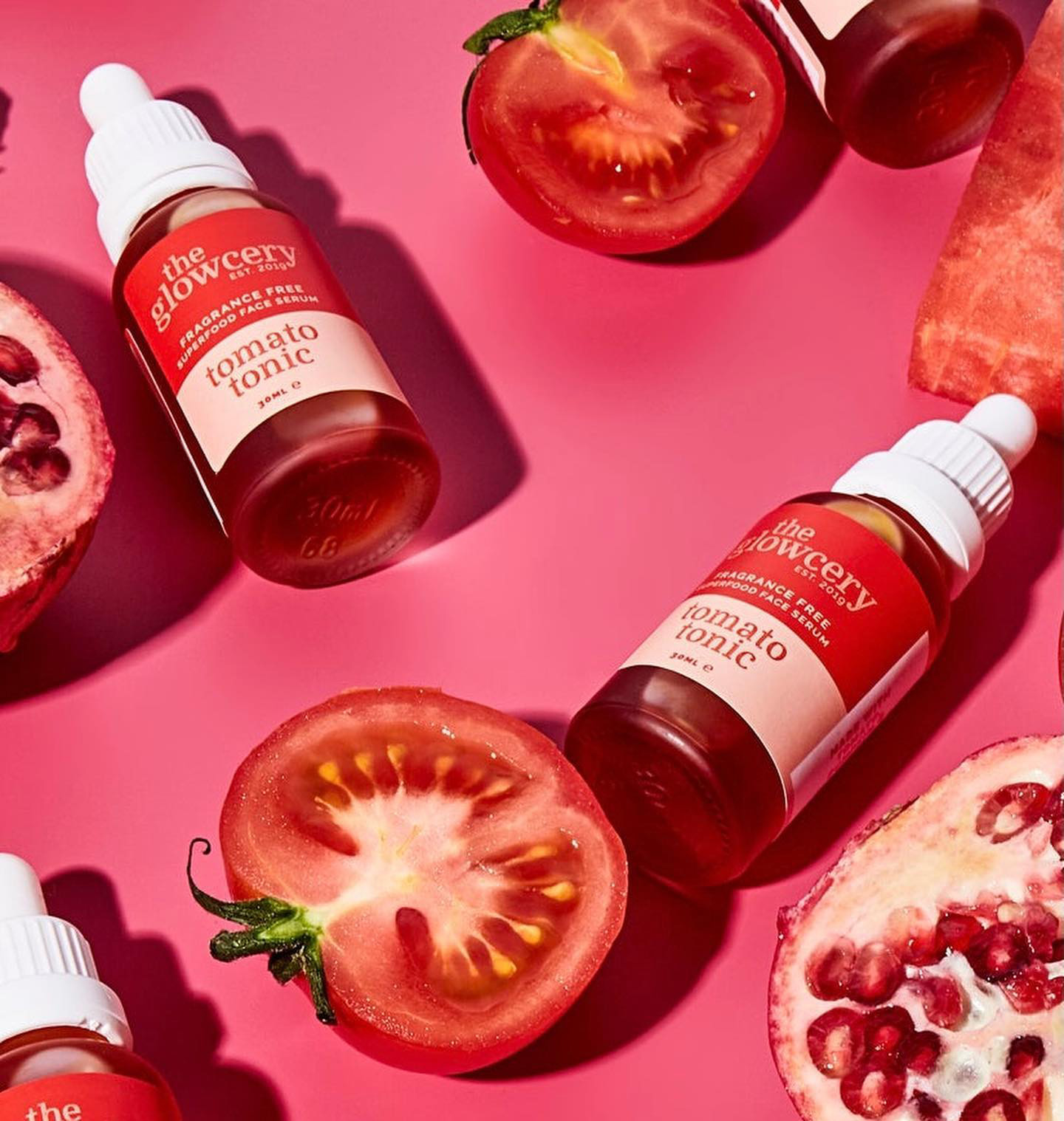 The Glowcery skincare products with pomegranate and tomatoes