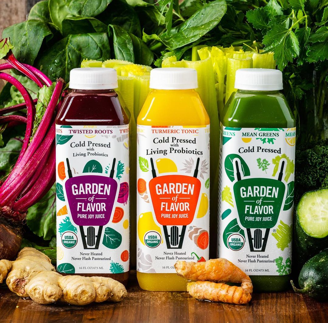 Garden of Flavor juices on table with veggies