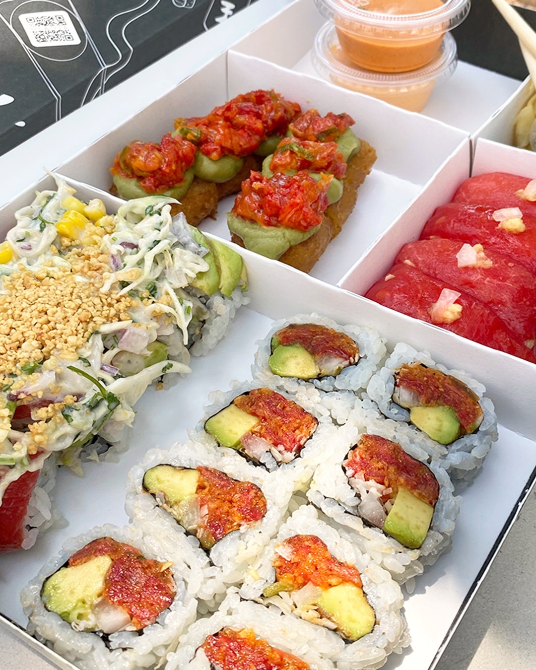 Various sushi rolls in box from Planta Queen