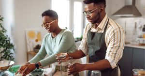 Two people cooking together