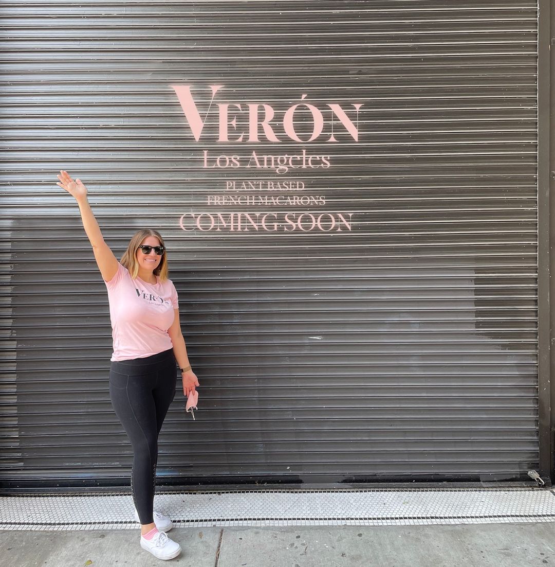 Founder of Verón standing in front of new location