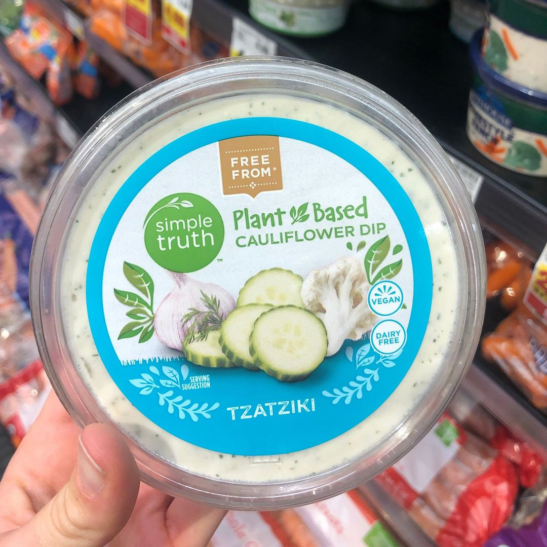 Person holding vegan Tzatziki dip from Simple Truth