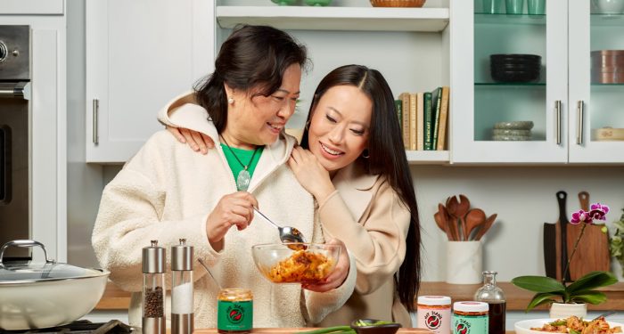 Owner of Hot Jiang and her mom in kitchen cooking