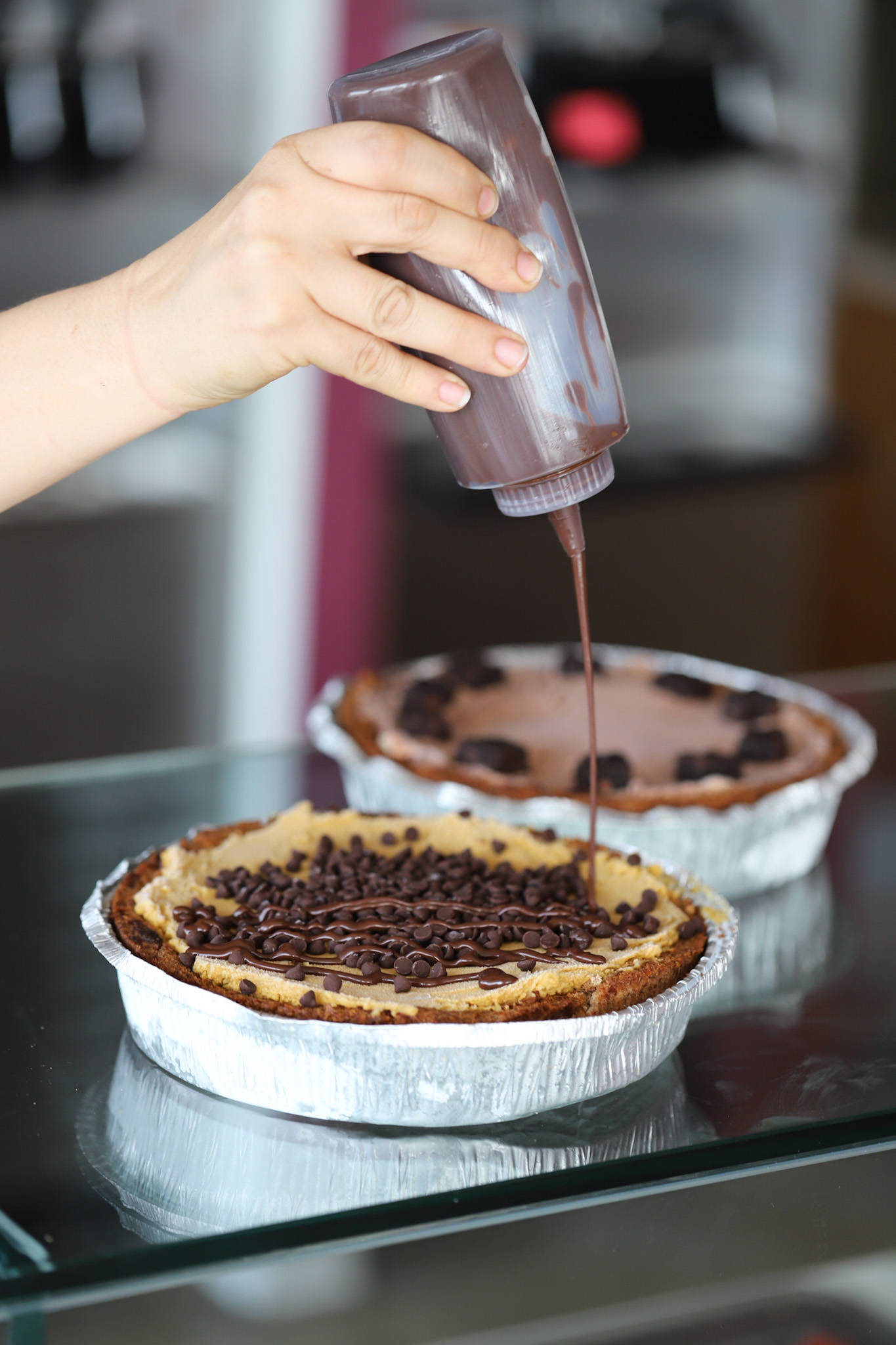 Yoga-urt pies on counter with chocolate drizzle