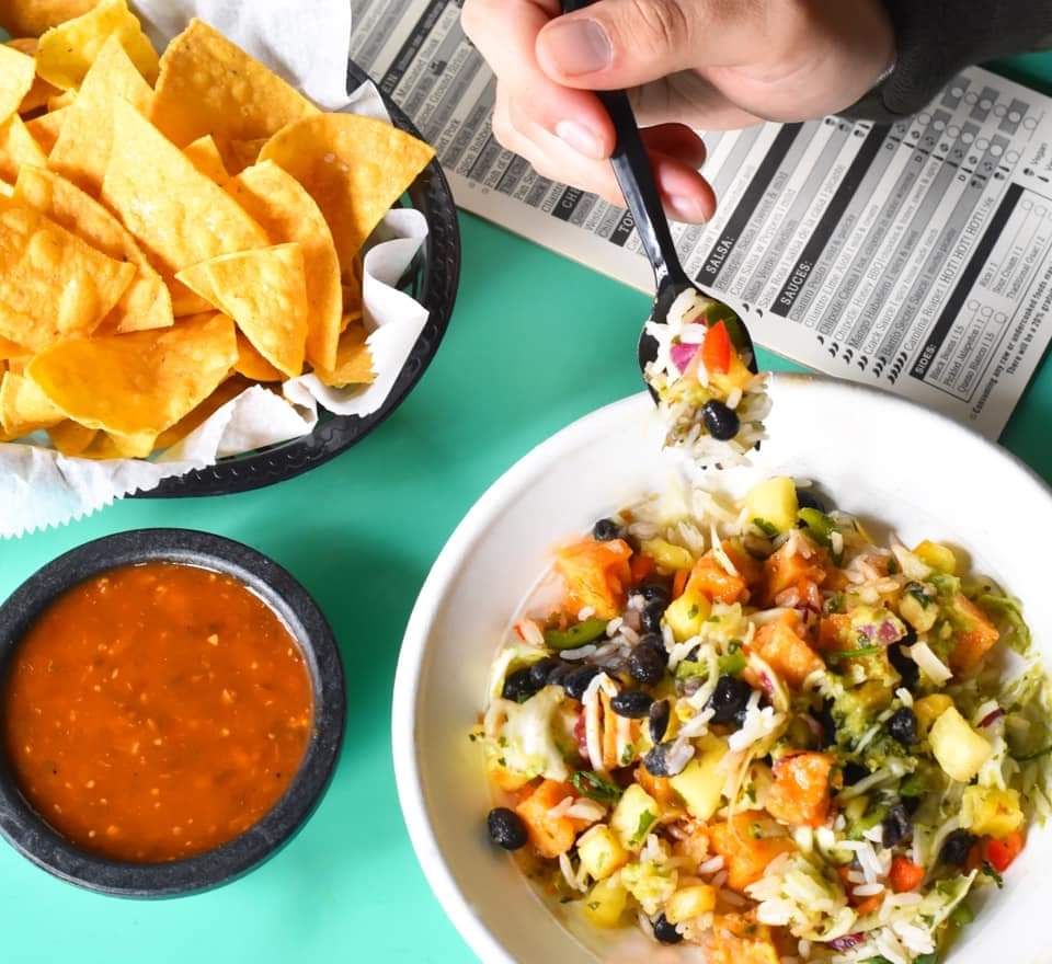 Barrio vegan bowl on table with chips and salsa