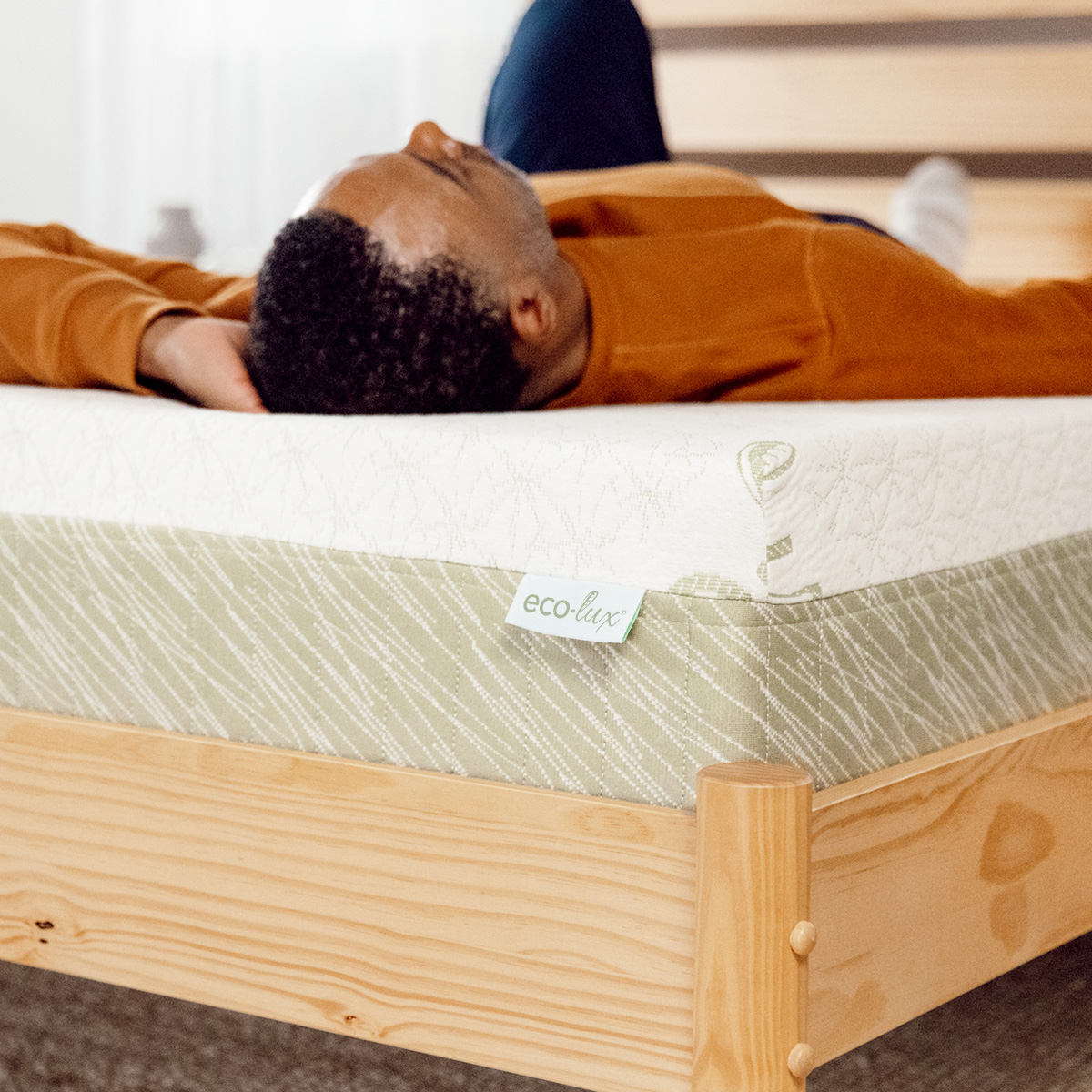 Person laying on BedInABox mattress