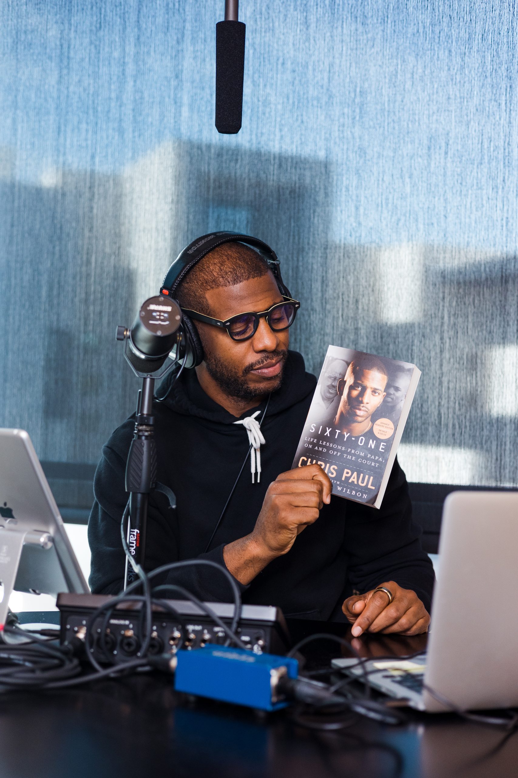 Chris Paul holding his new book