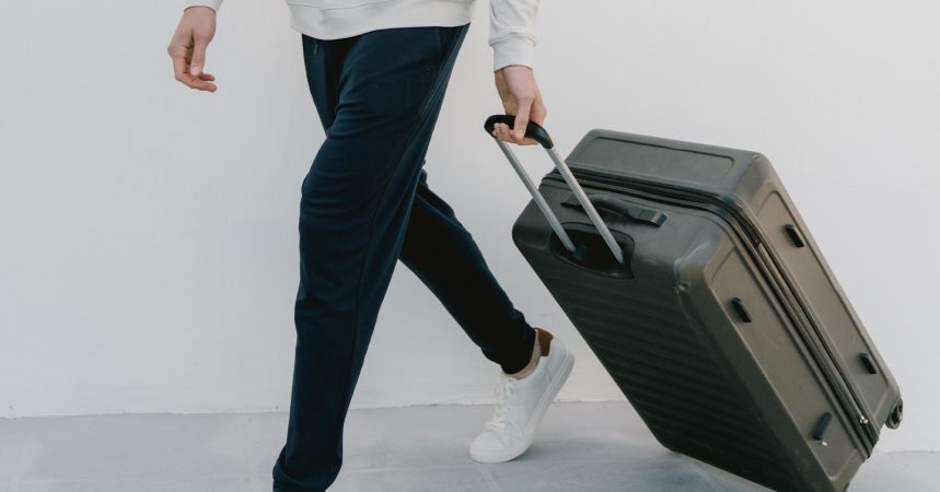 Person walking with suitcase in Cozy Earth joggers
