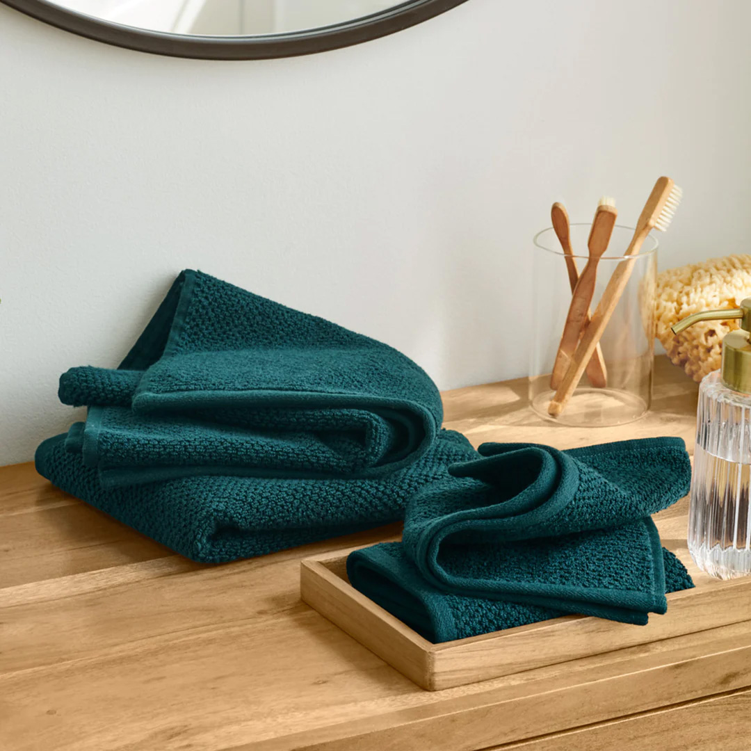 Towels sitting on counter in bedroom