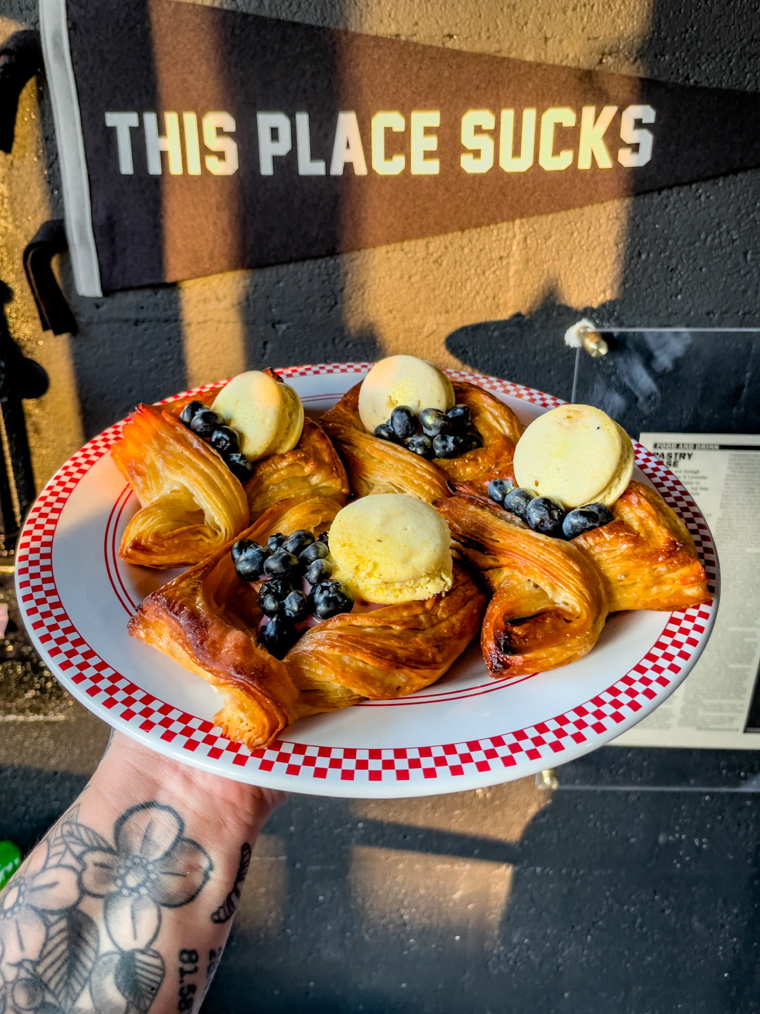 Person holding plate of vegan pastries from Yellow & Lavender