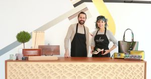 Founders holding Mohop accessories and shoes