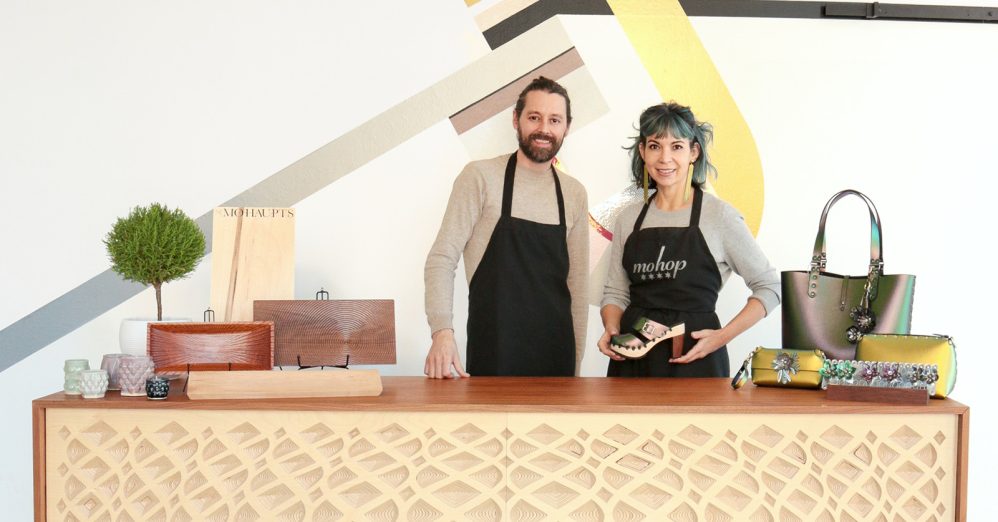 Founders holding Mohop accessories and shoes