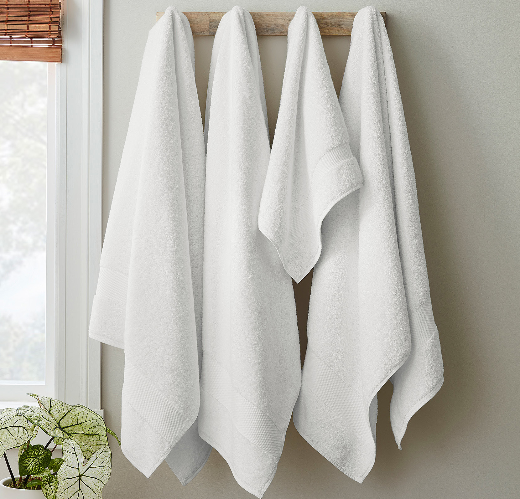 Boll & Branch towels hanging in bathroom