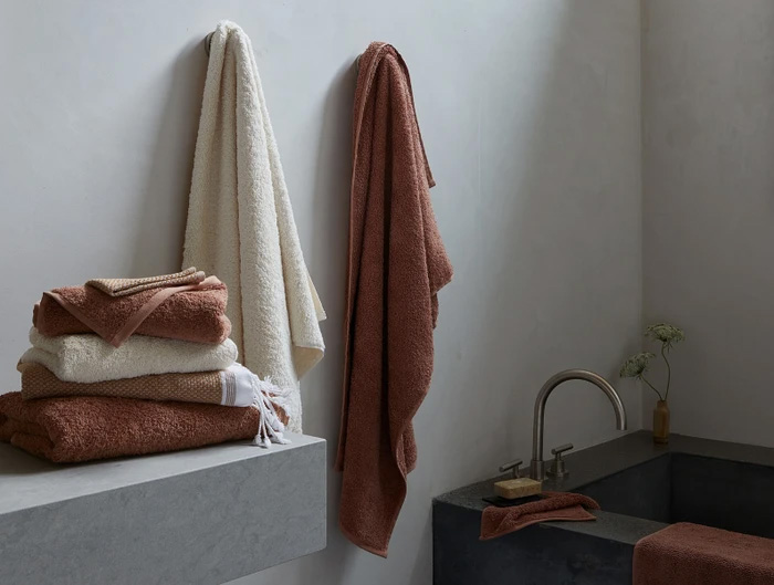 Coyuchi towels hanging in bathroom