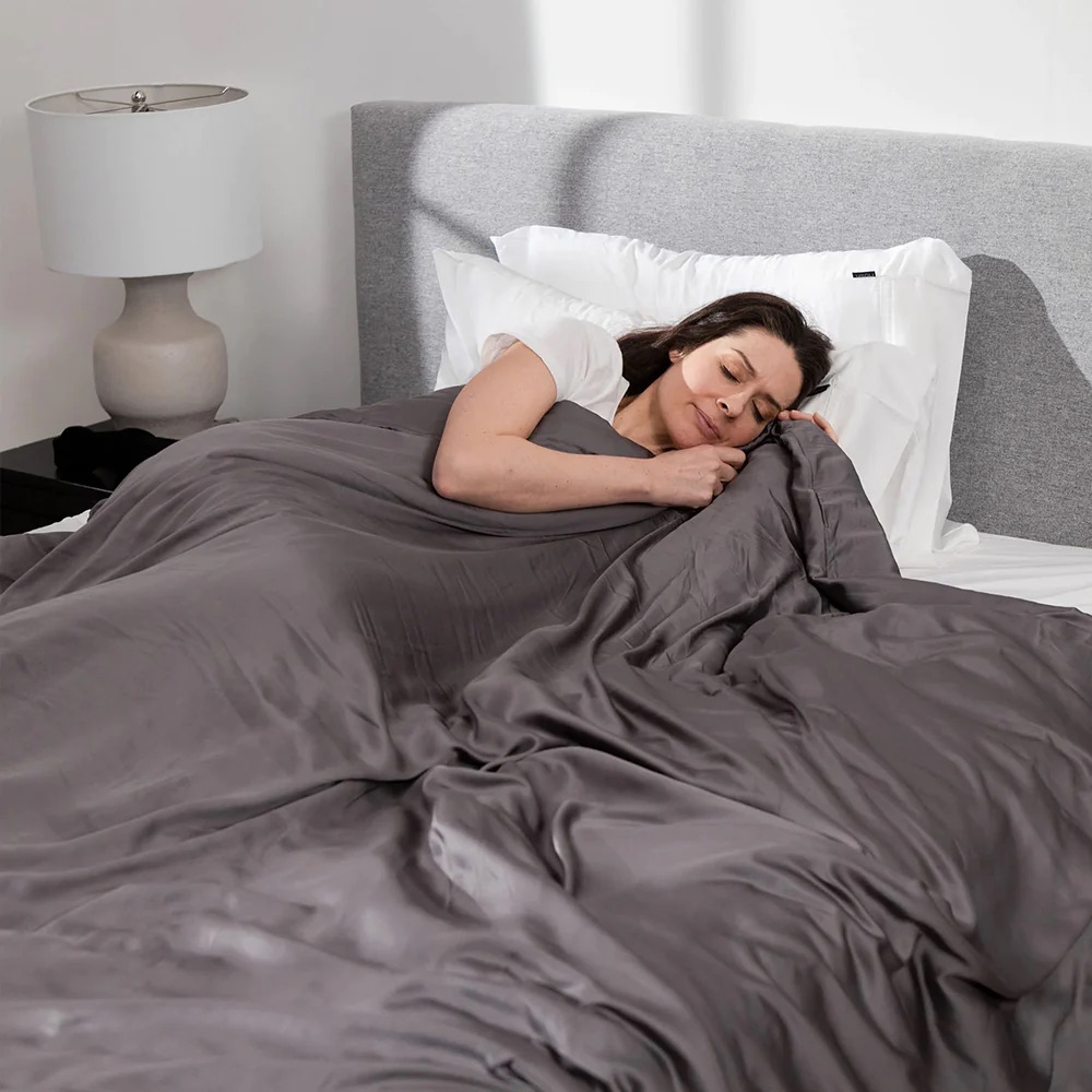 Person in bed with Zonli Home weighted blanket