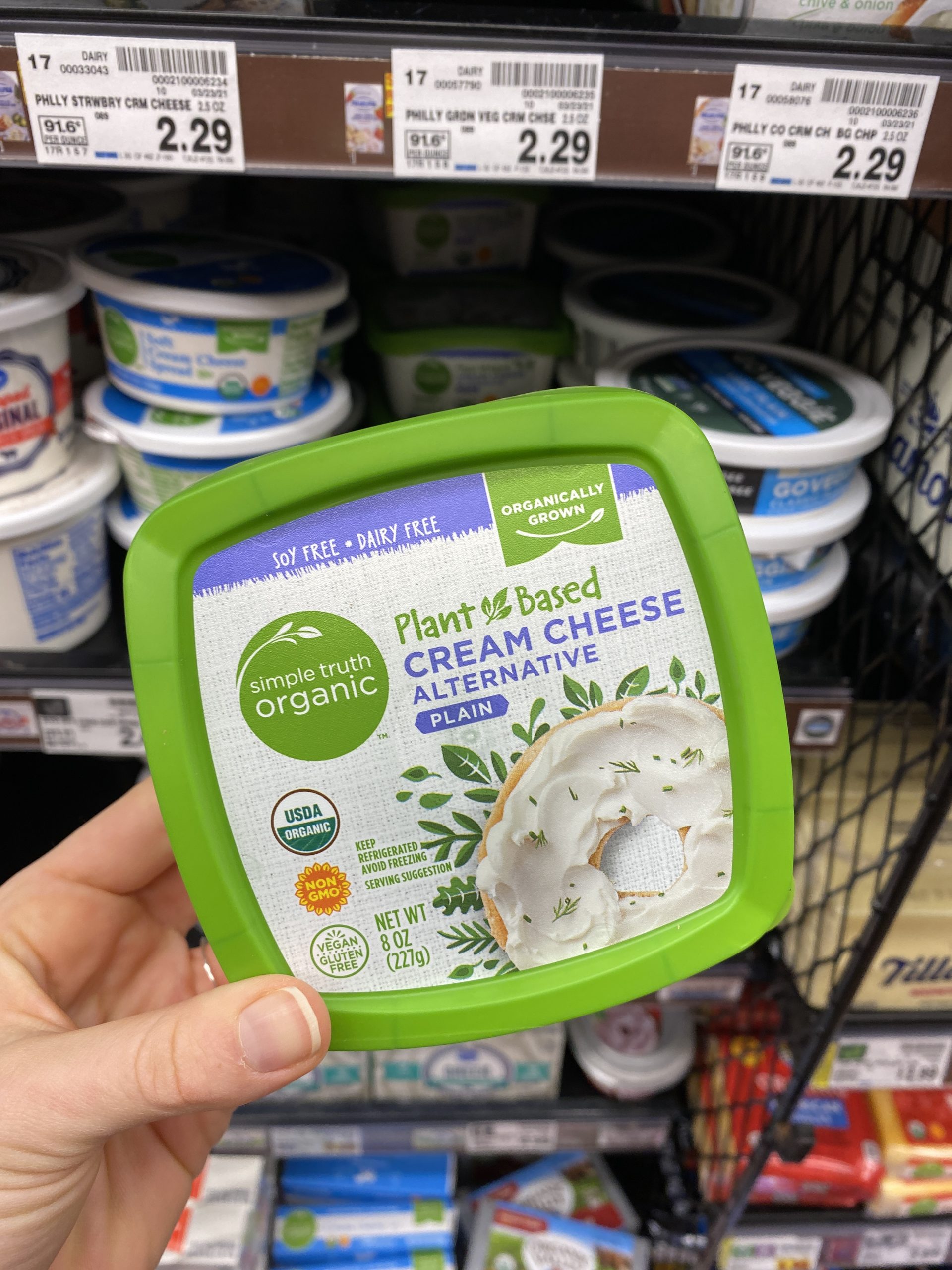 Person holding vegan cream cheese