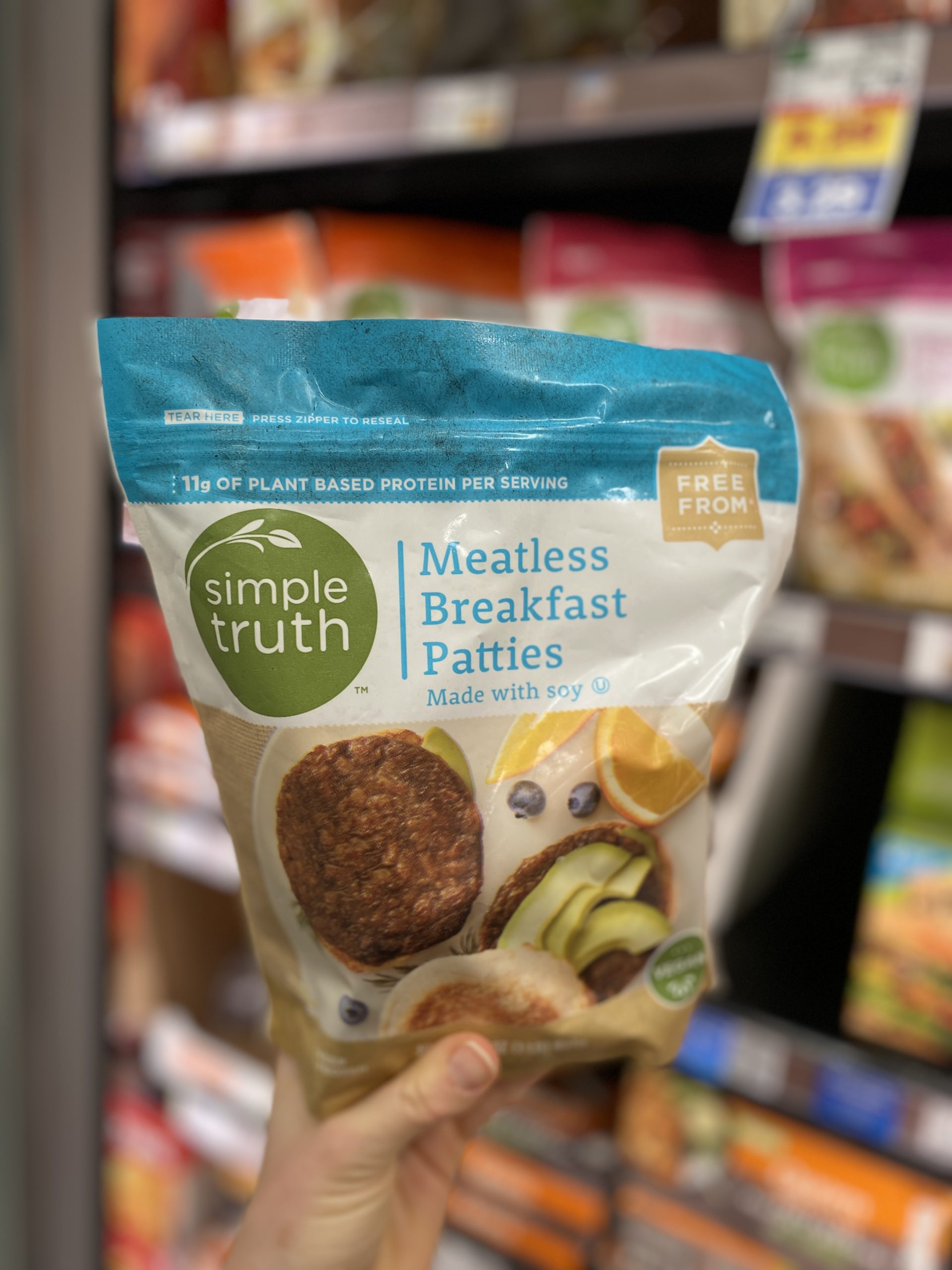 Person holding vegan meatless breakfast patties