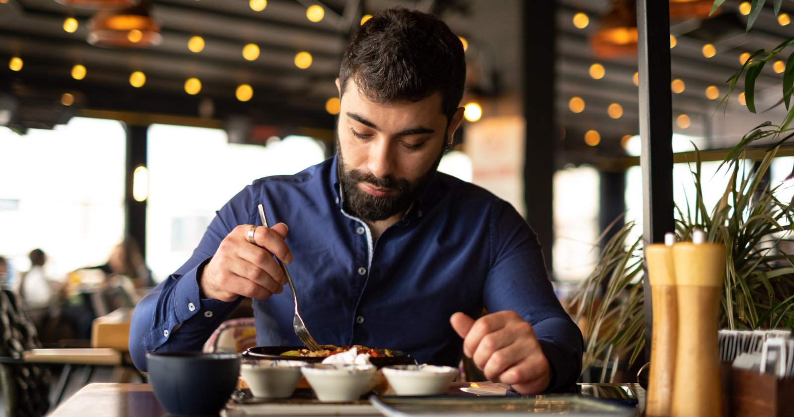 People who regularly dine alone aren't necessarily lonely — they're often the people who finally figured out that eating in the company of someone uninterested in them is a quieter kind of loneliness than eating in their own company has ever been