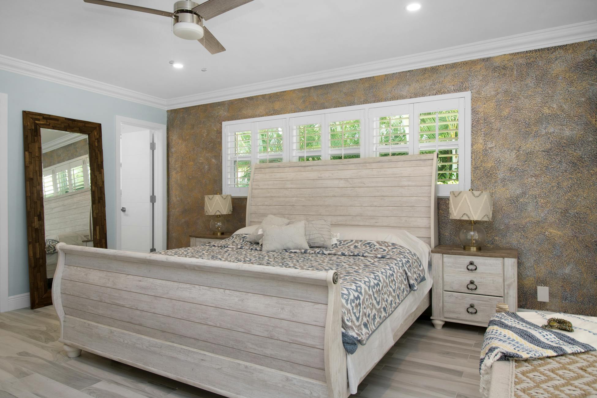 Elegant modern bedroom featuring wooden furniture and minimalist design, perfect for relaxation.