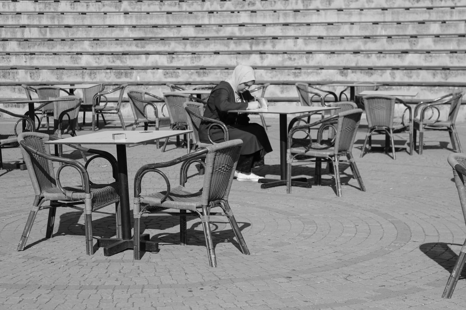 woman café alone reading