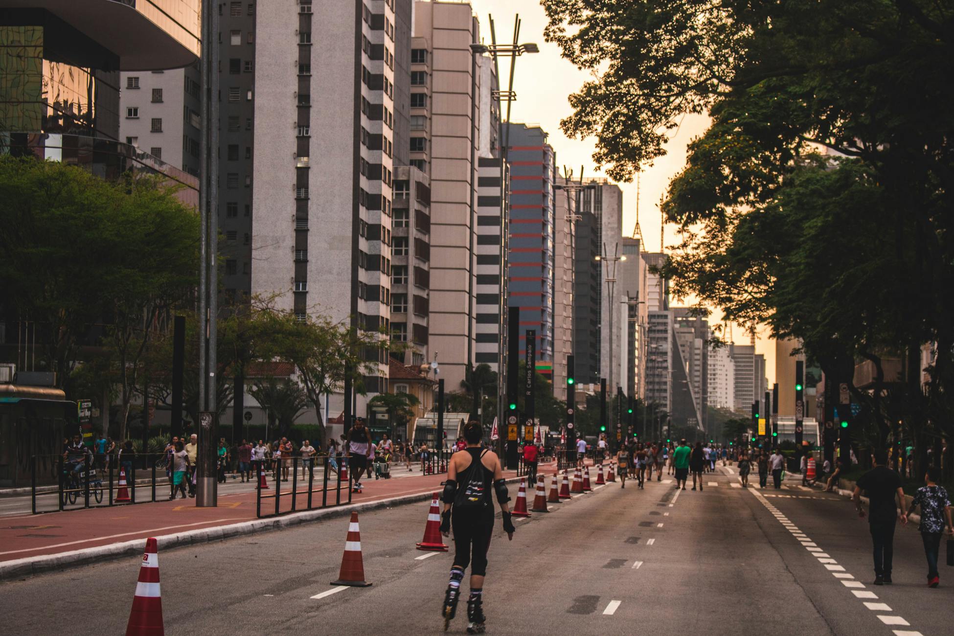 People enjoying street activities in Bela Vista, São Paulo during daytime.