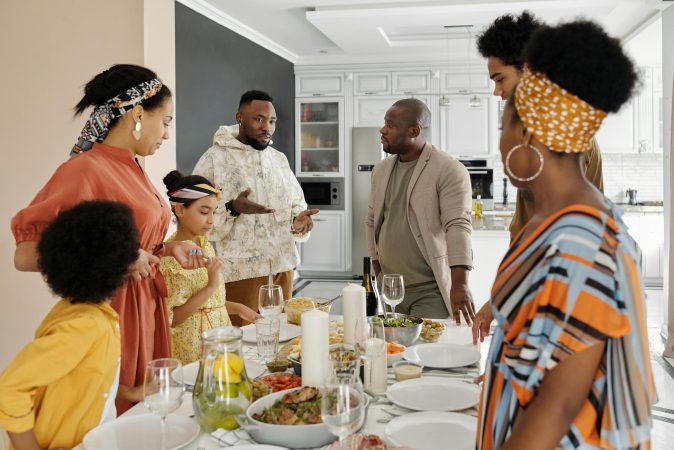 A diverse family enjoying a vibrant meal together, showcasing warmth and connection.