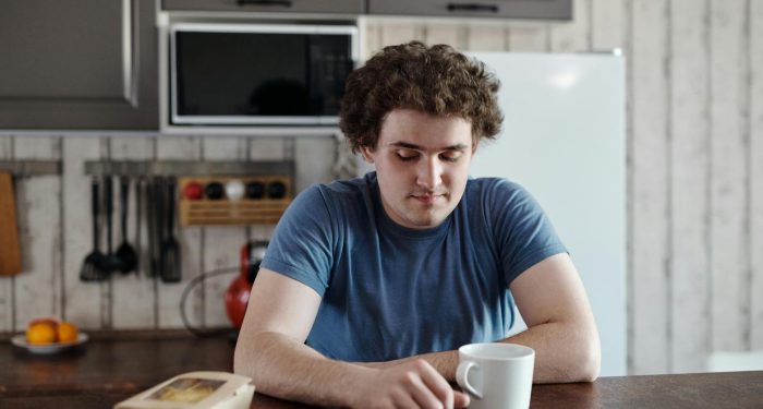 person alone kitchen morning