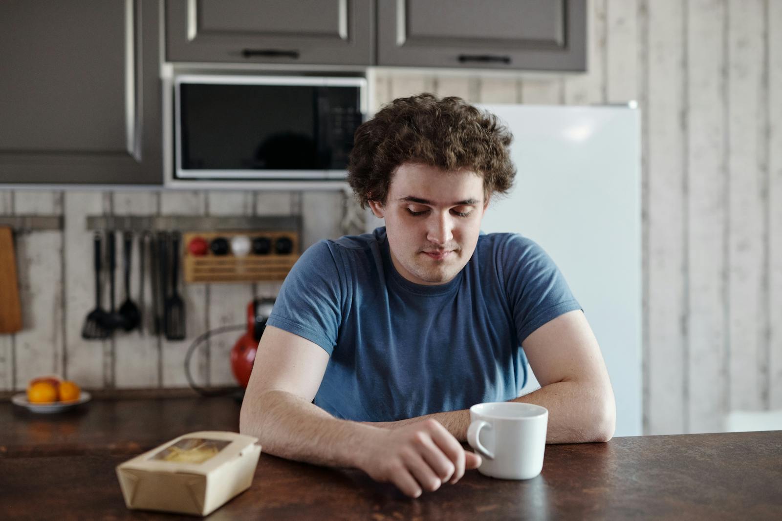 person alone kitchen morning