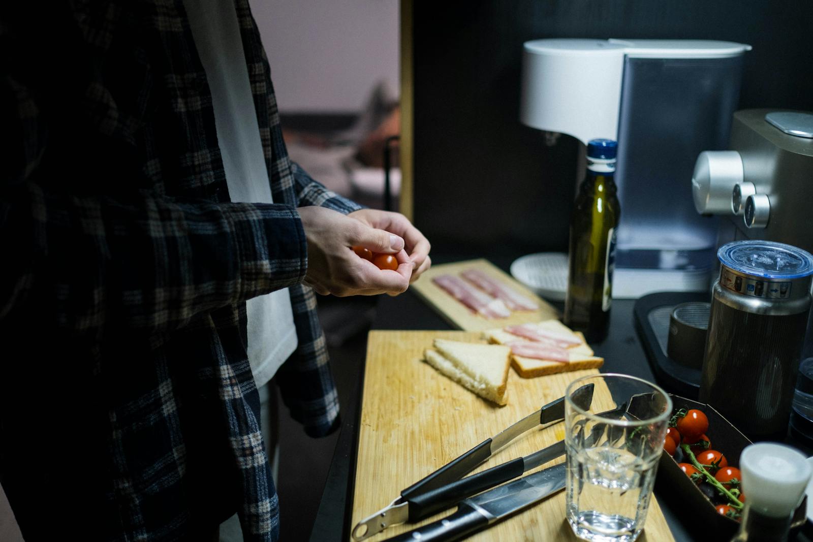 person cooking alone kitchen evening