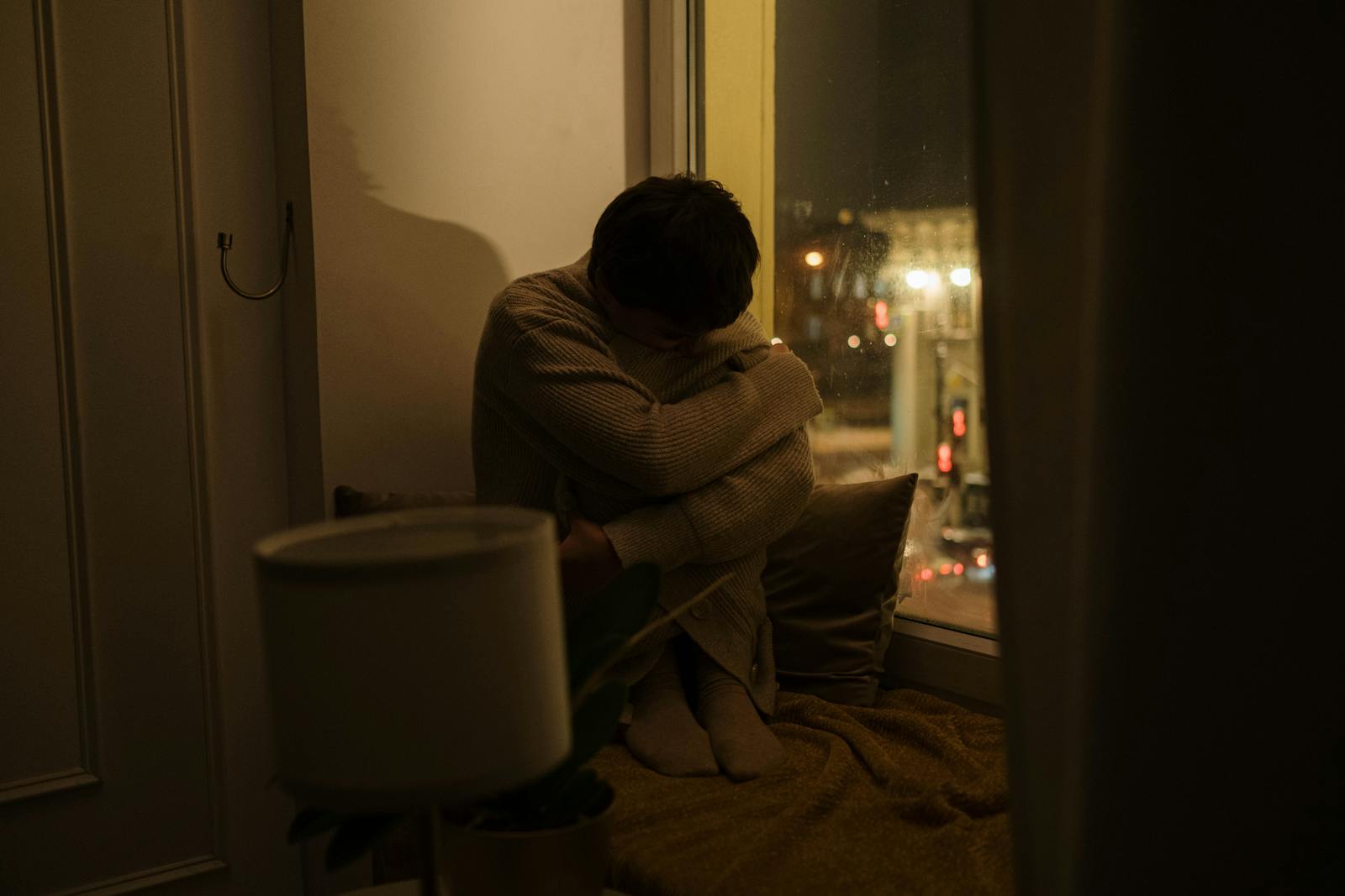 person sitting alone window