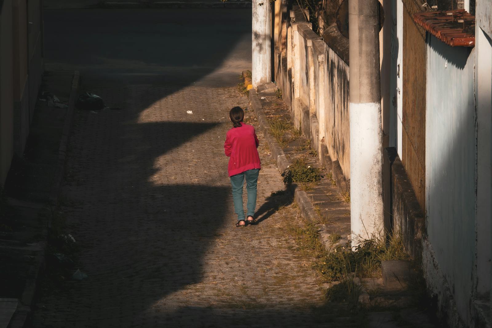 person walking aimlessly city street