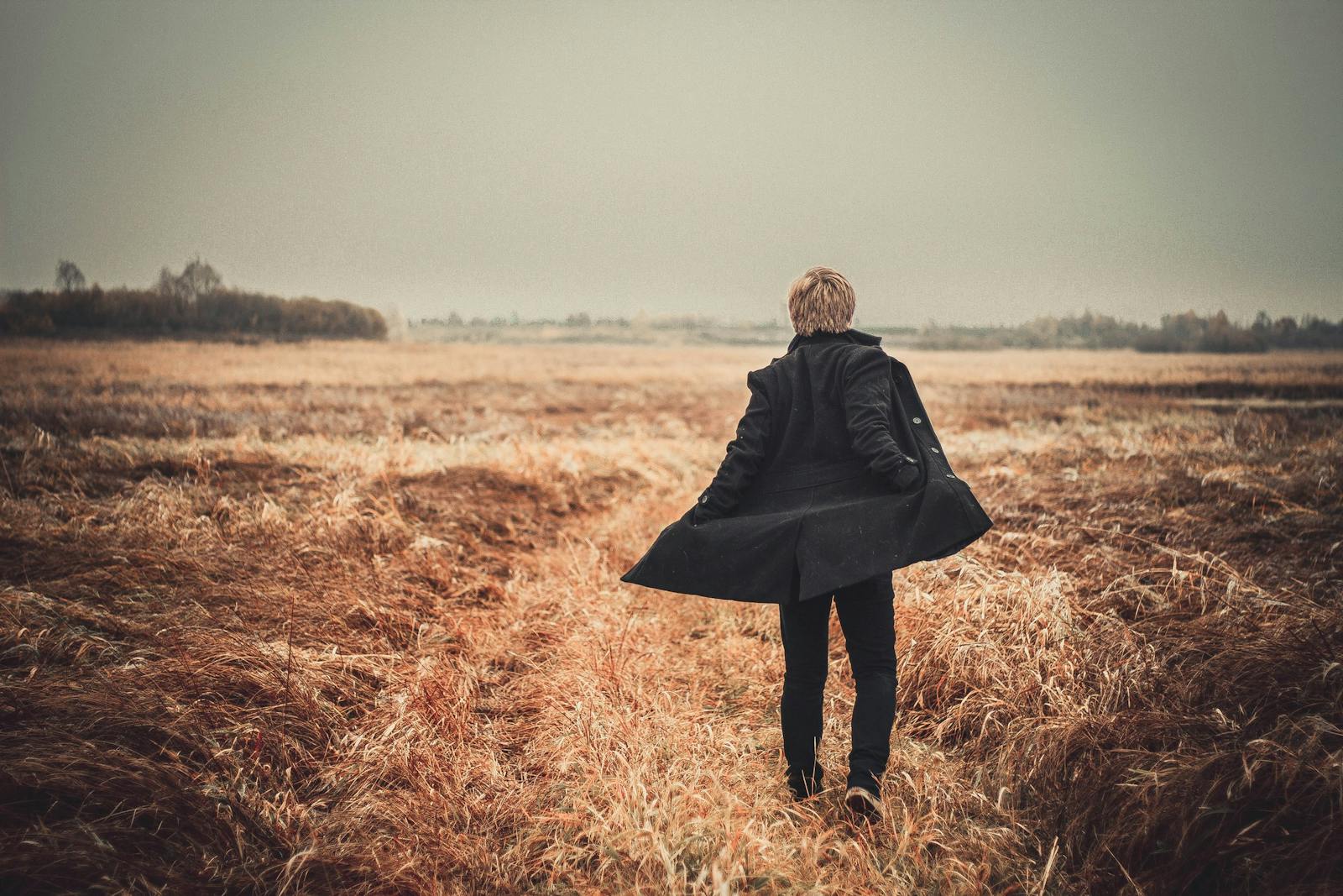 person walking alone golden hour