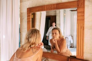 The people who seem most at ease in their bodies didn't necessarily learn to love how they look. They learned to stop narrating their appearance to themselves all day long.