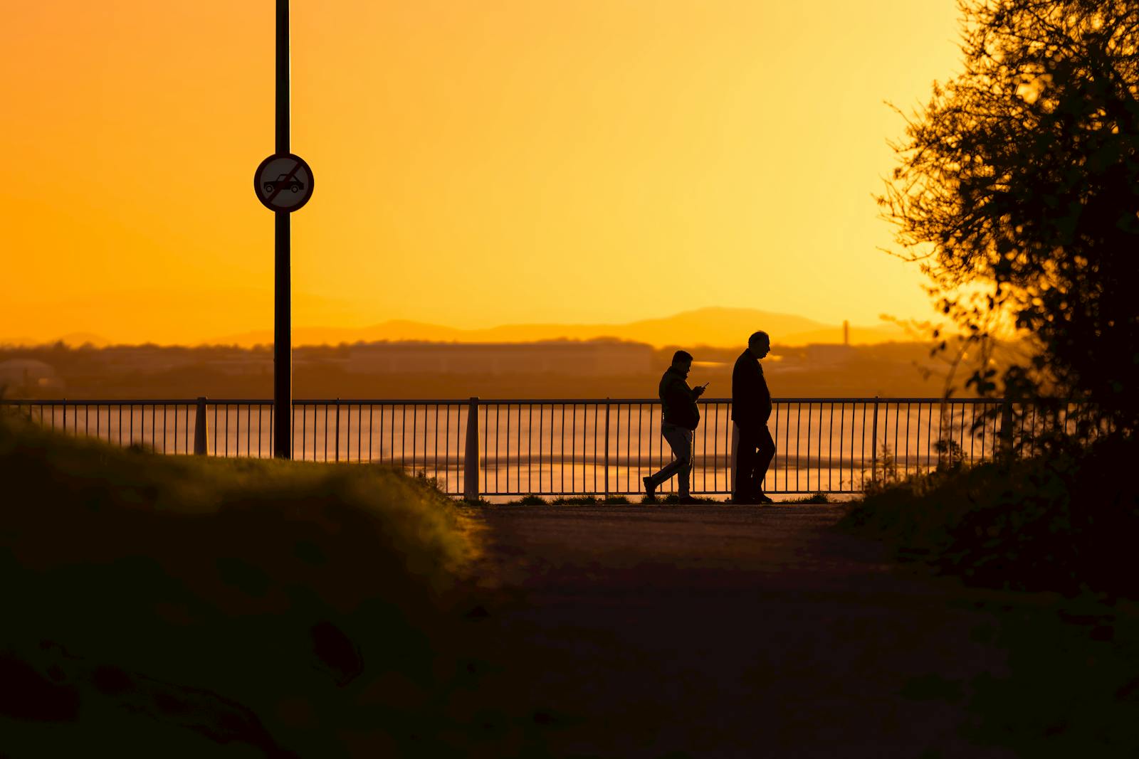 two people walking quiet neighborhood