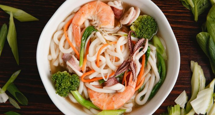 Weeknight Coconut Curry Udon With Crispy Mushrooms and Wilted Greens in 20 Minutes