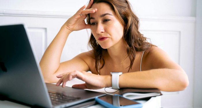 woman laptop overwhelmed tabs