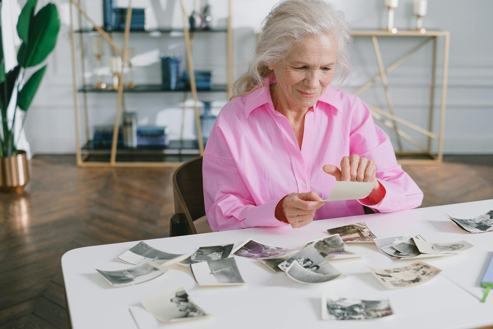 woman looking at old photograph