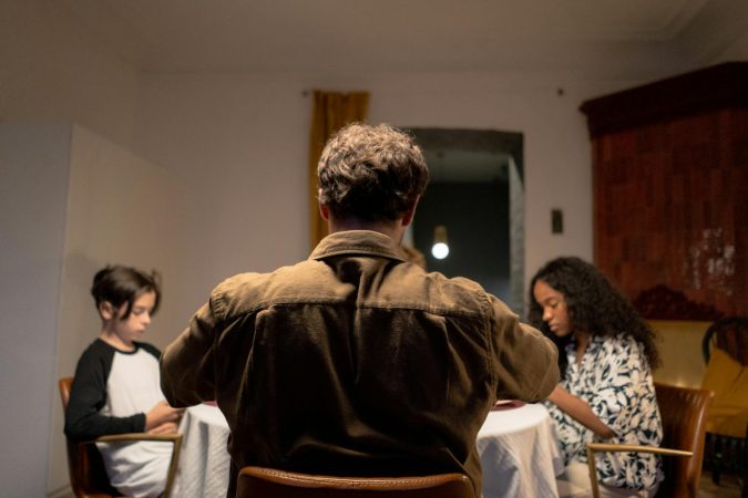 Adults who can sit through a long silence at the dinner table without rushing to fill it grew up in homes where silence wasn't dangerous, and that single ordinary fact shaped more of their adult relationships than any of them realise