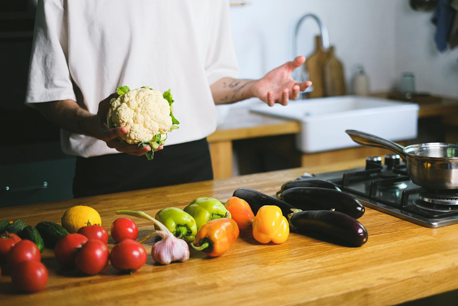middle-aged person cooking vegetables
