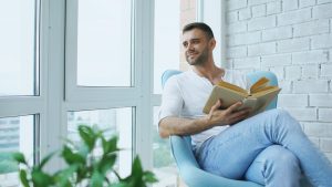 person reading alone window