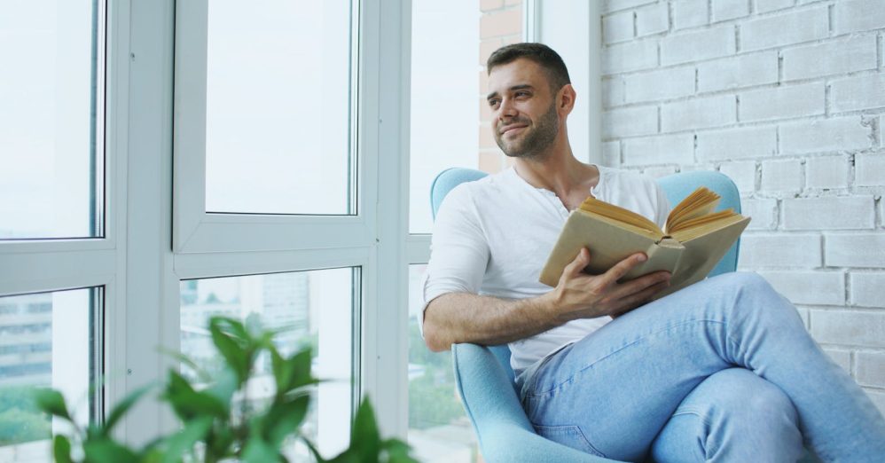 person reading alone window