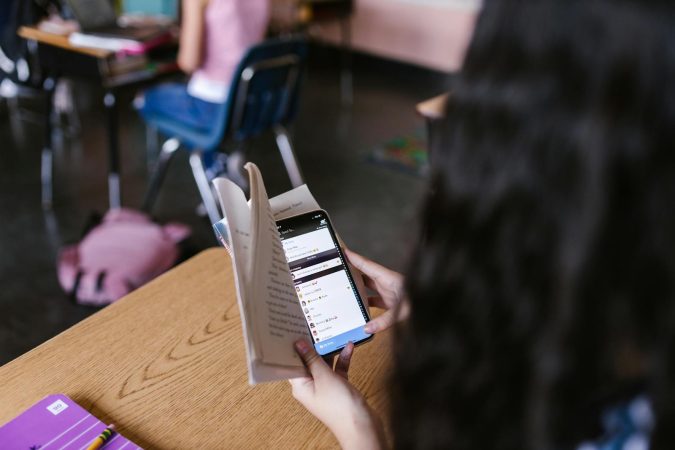 Psychology says adults who keep their phone face-down on every table aren't being polite, they spent their childhood reading a parent's mood the moment they walked in the room and they're still trying to control which signals reach them